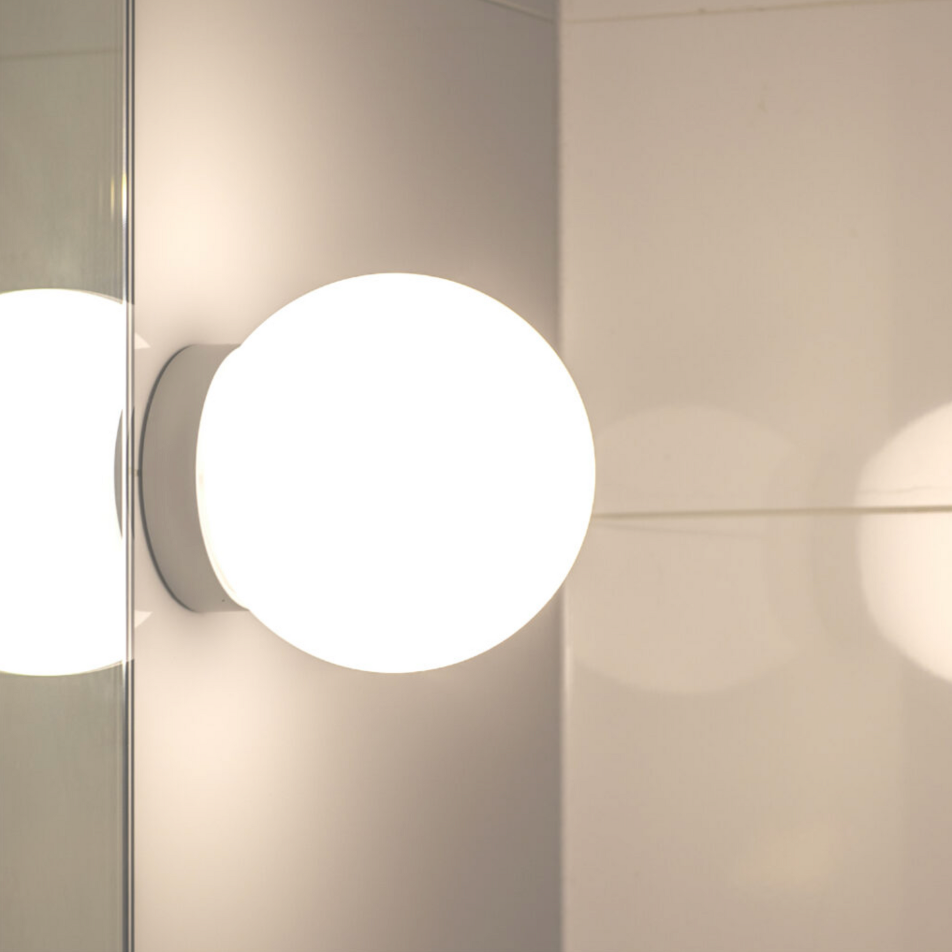 Round wall light fixture on a neutral background