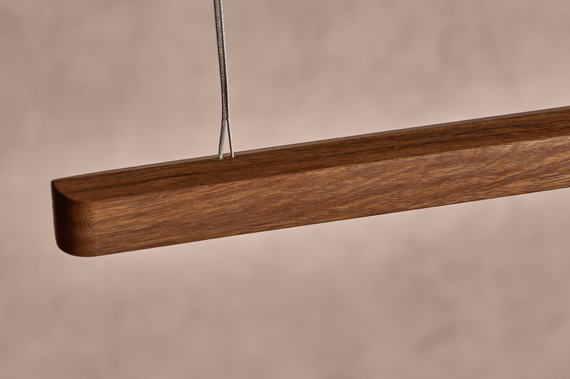 Close-up of House timber pendant light end detail with cable suspension – Australian hardwood