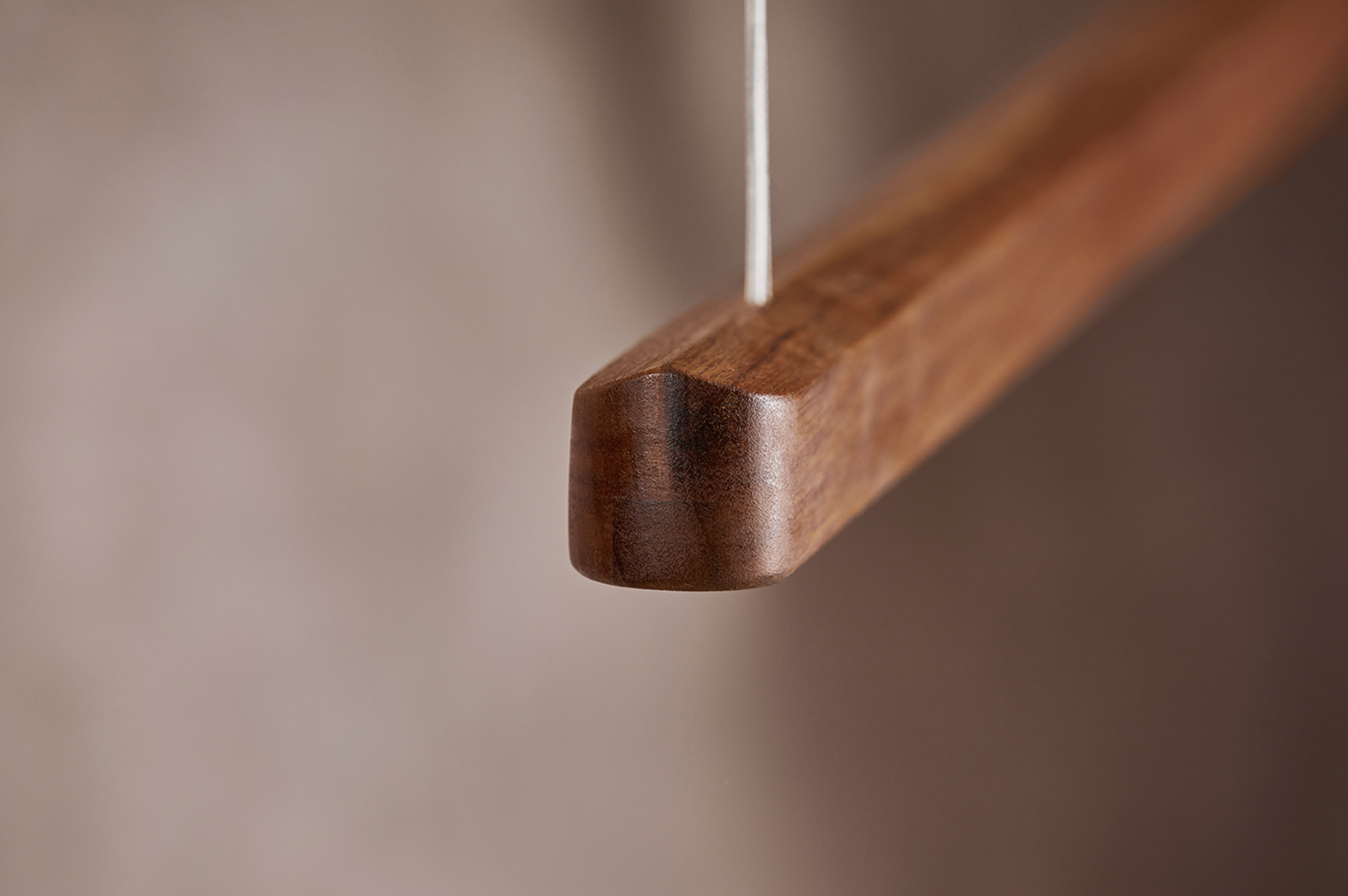 Close-up of House linear pendant light end cap in Australian hardwood timber – Sundown Lighting