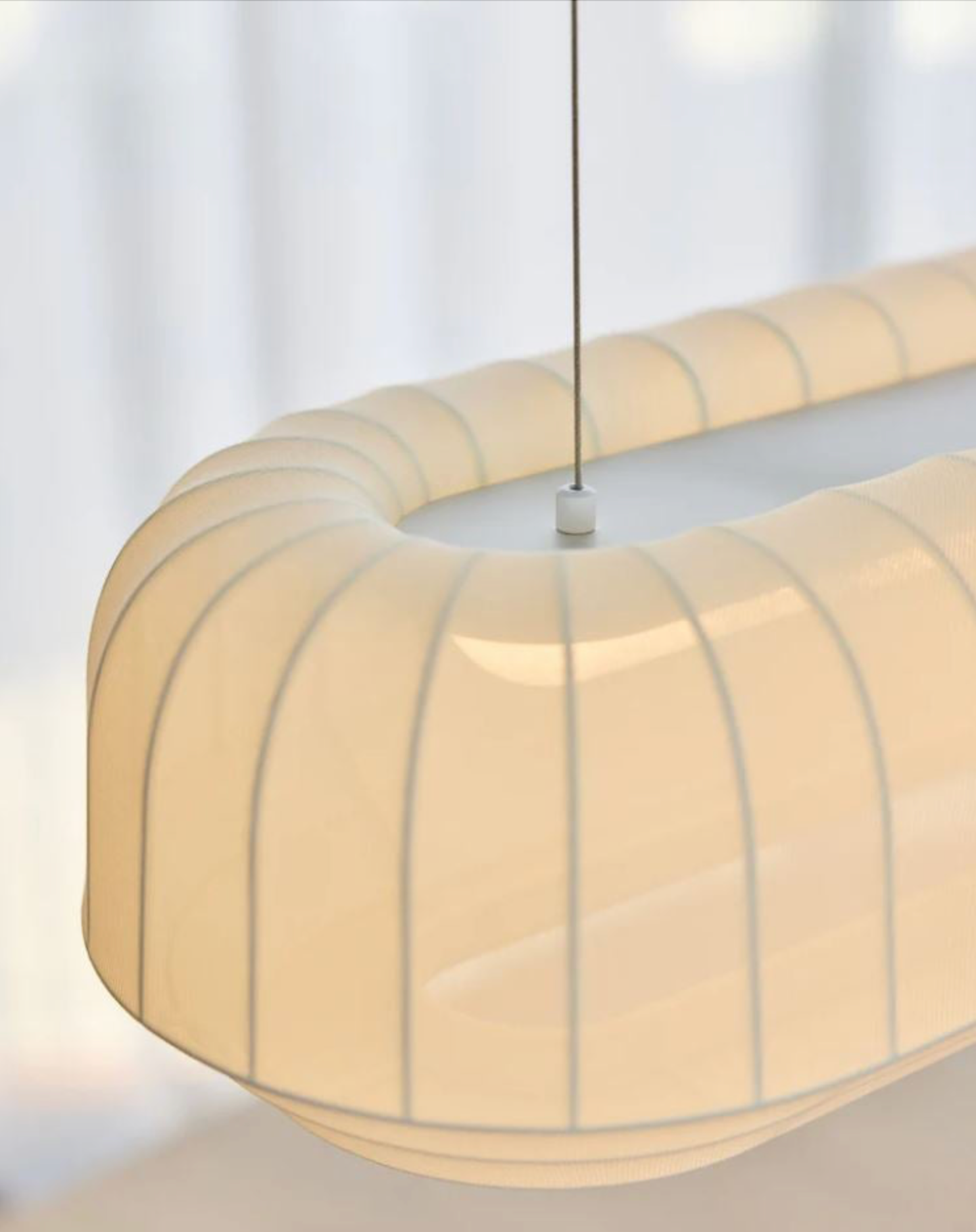 Soft linear pendant light a white background