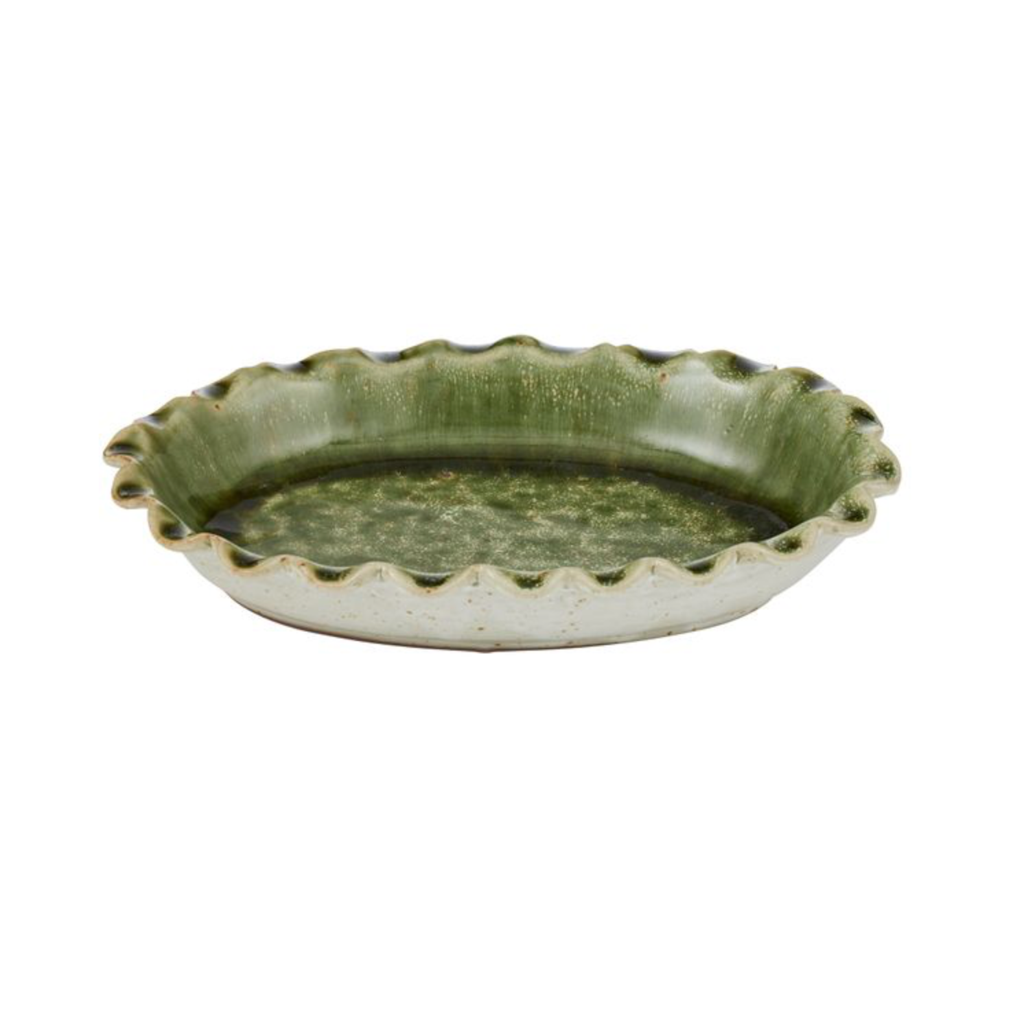 Green ceramic dish with scalloped edge on a white background
