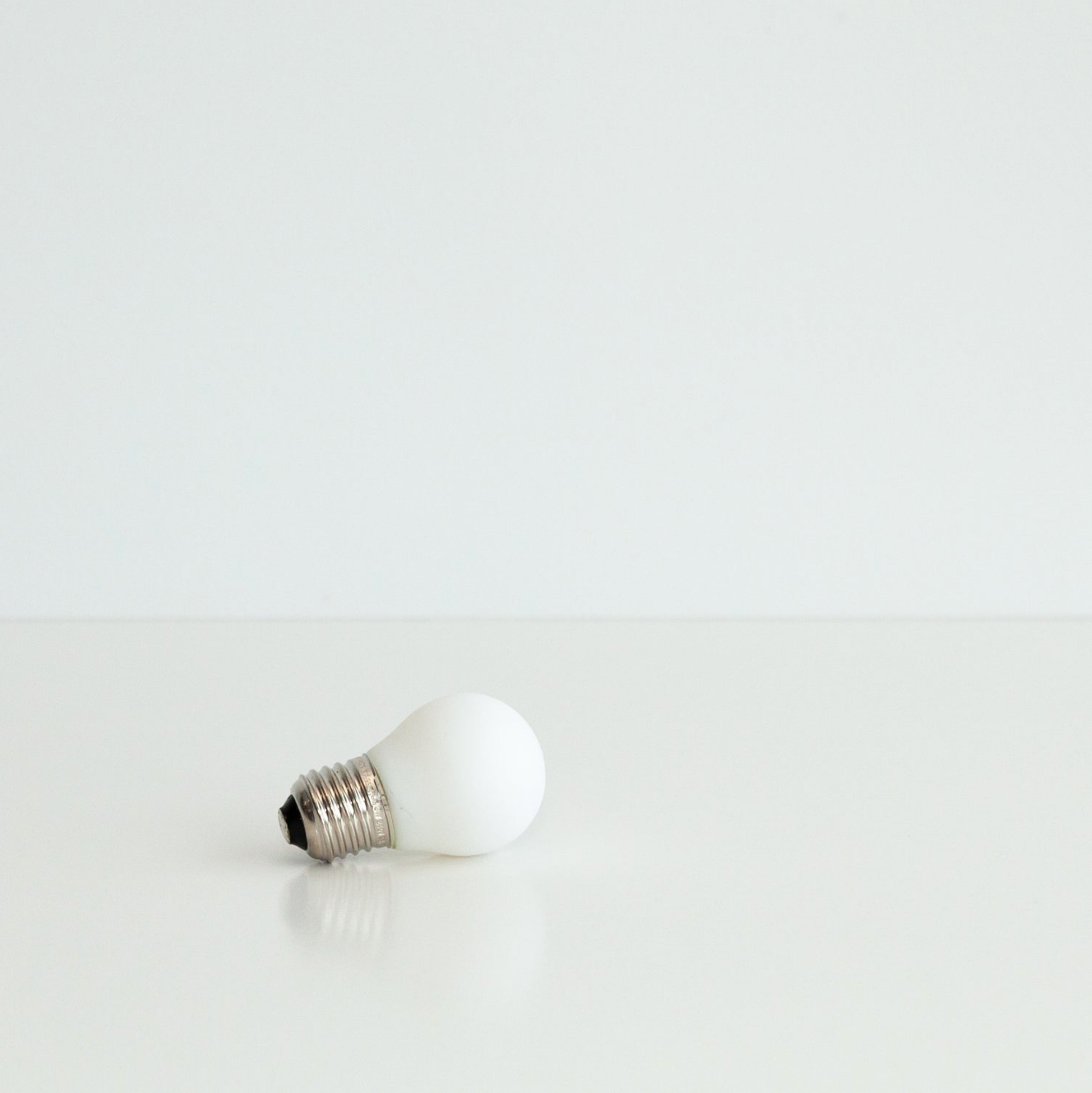 White light bulb on a white background
