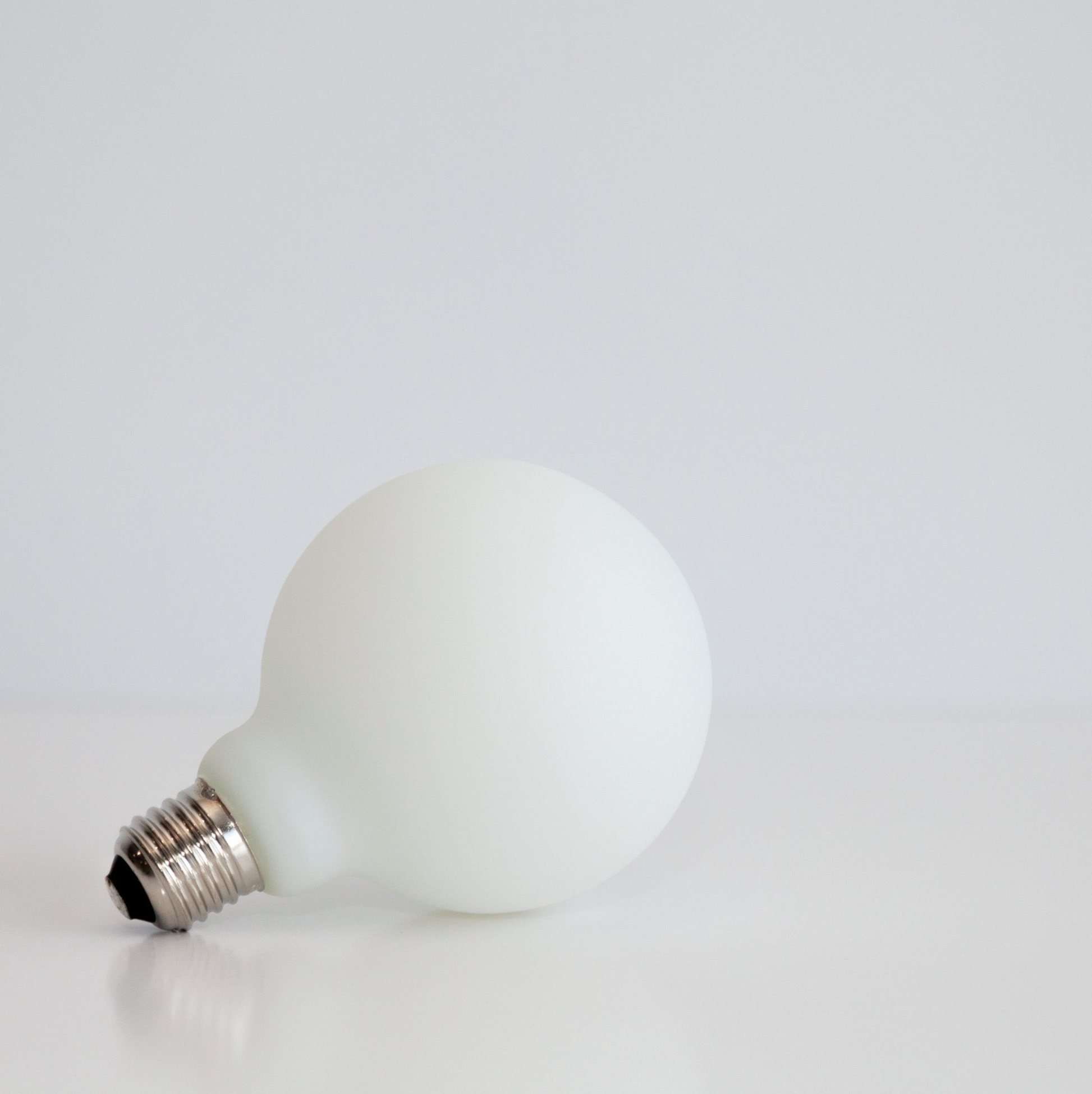 White light bulb on a white background