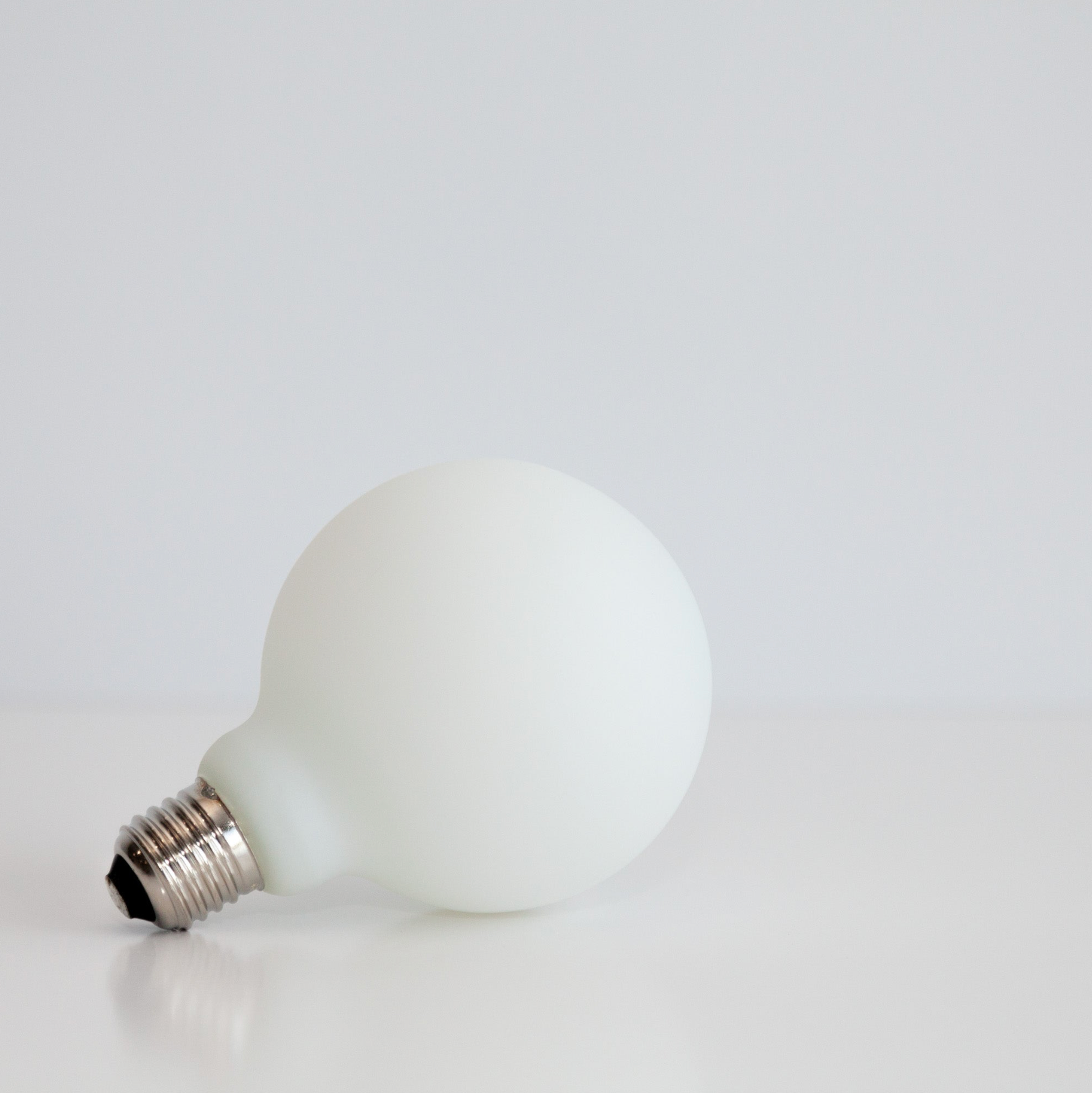 White light bulb on a white background