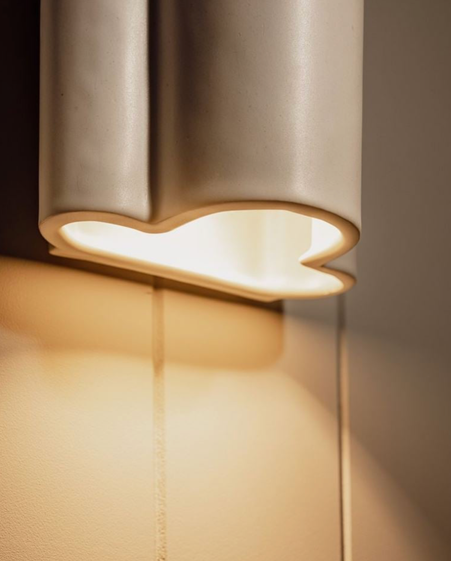 Modern wall light fixture on a neutral background