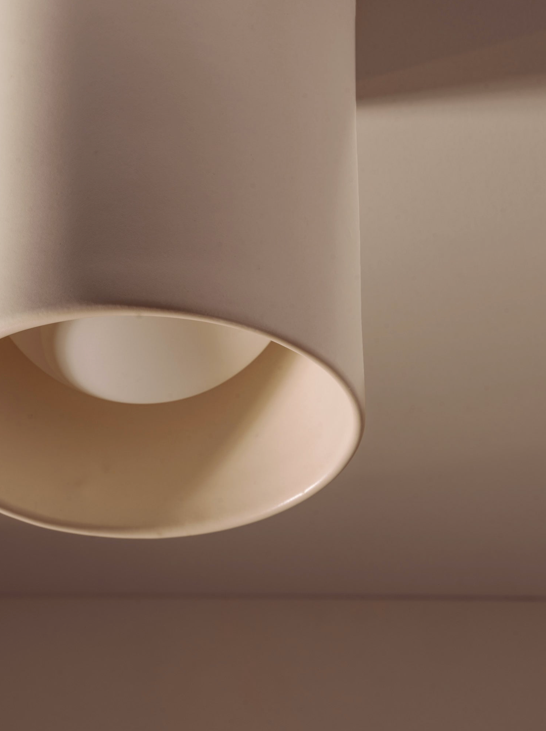 Beige ceiling light fixture on a neutral background
