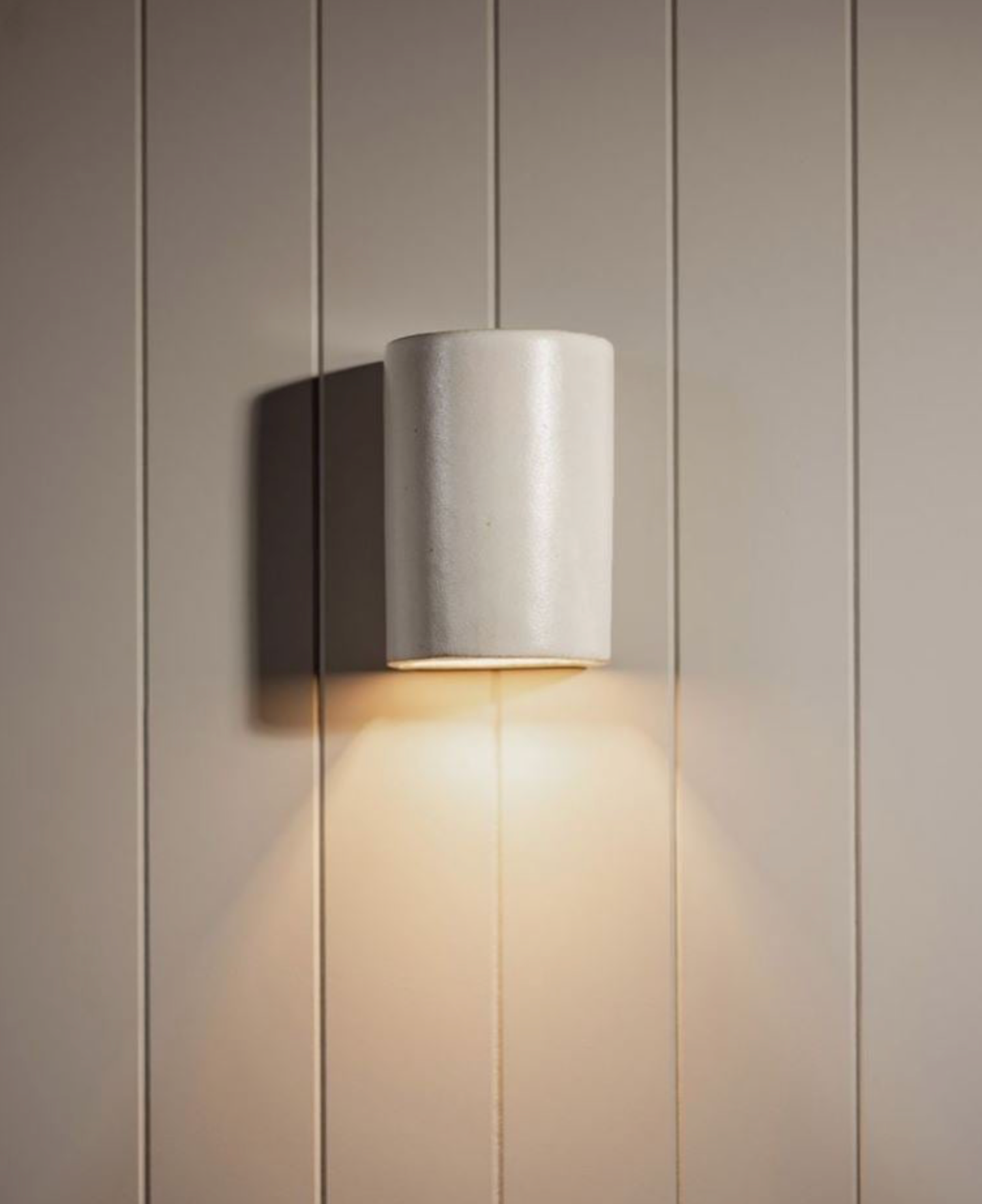 Wall-mounted light fixture on a neutral wall