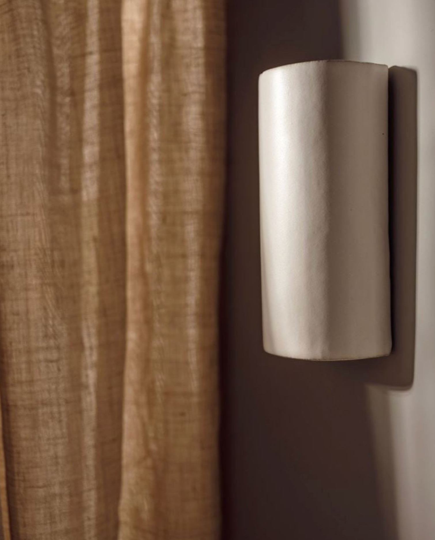 Ceramic interior wall light on neutral wall