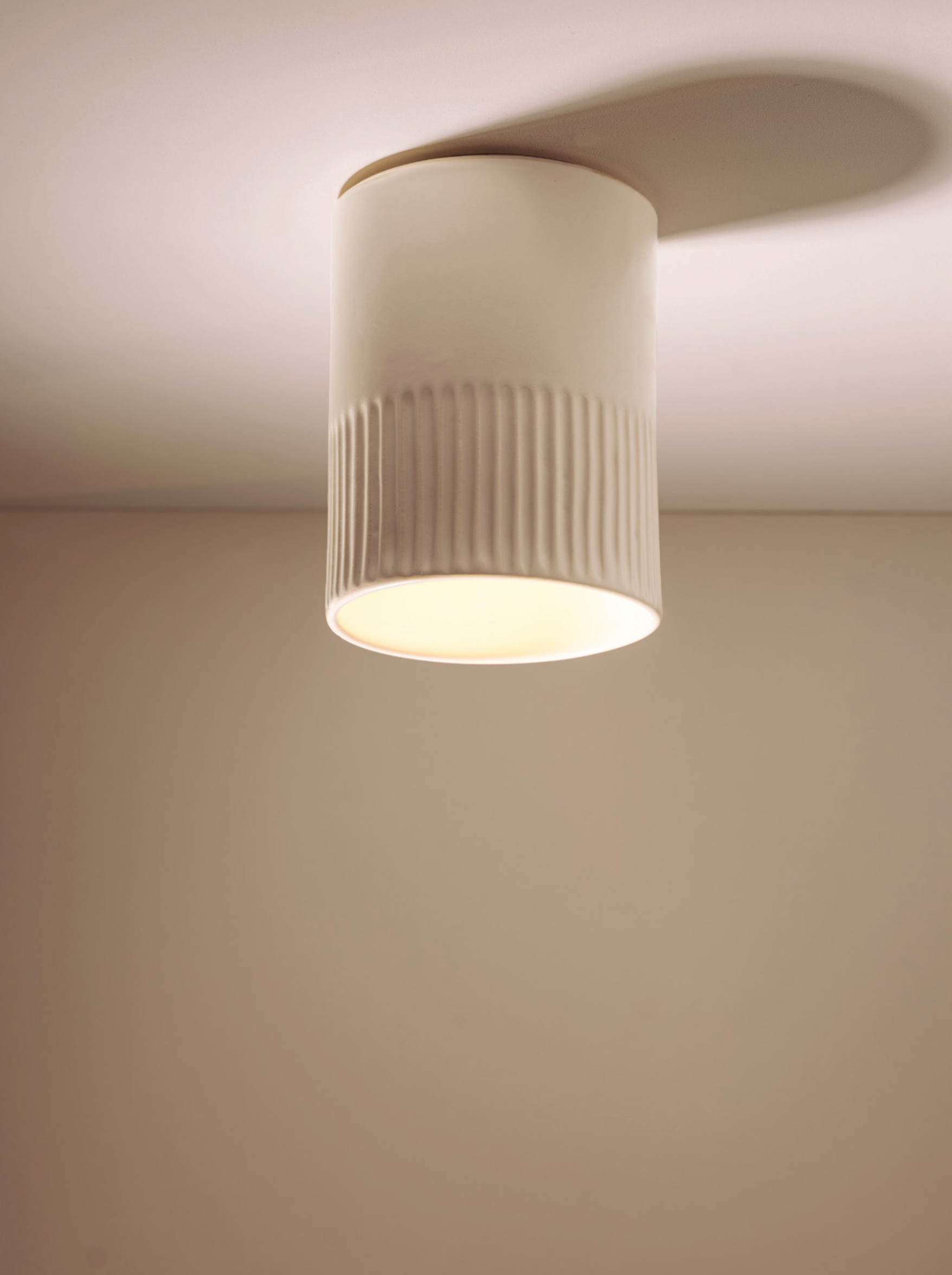 Ceiling light fixture on a plain wall
