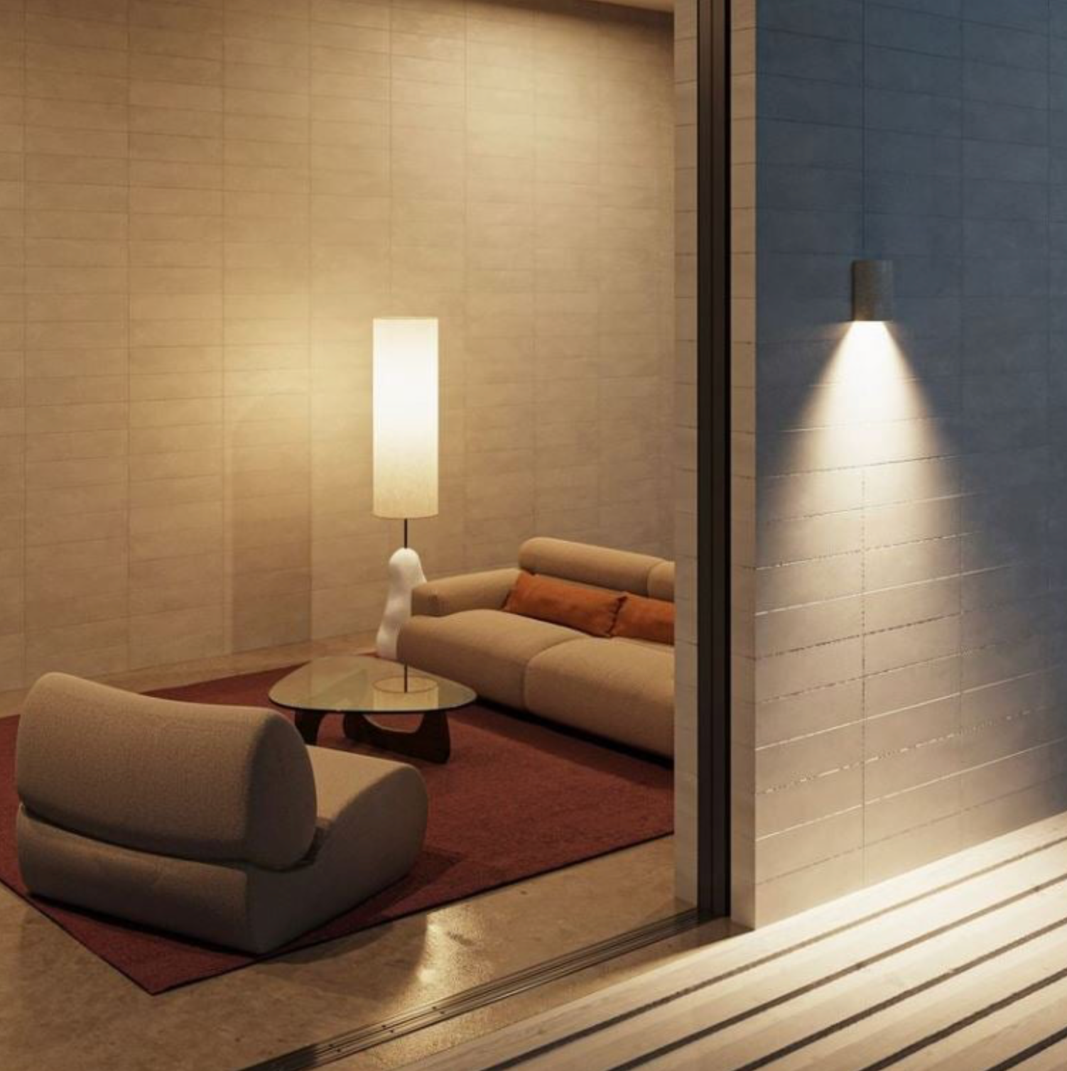 Modern furniture setting with a sofa, coffee table, floor lamp and outdoor wall light. 