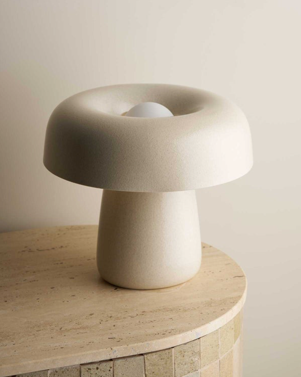 Modern ceramic lamp with a unique design on a wooden surface