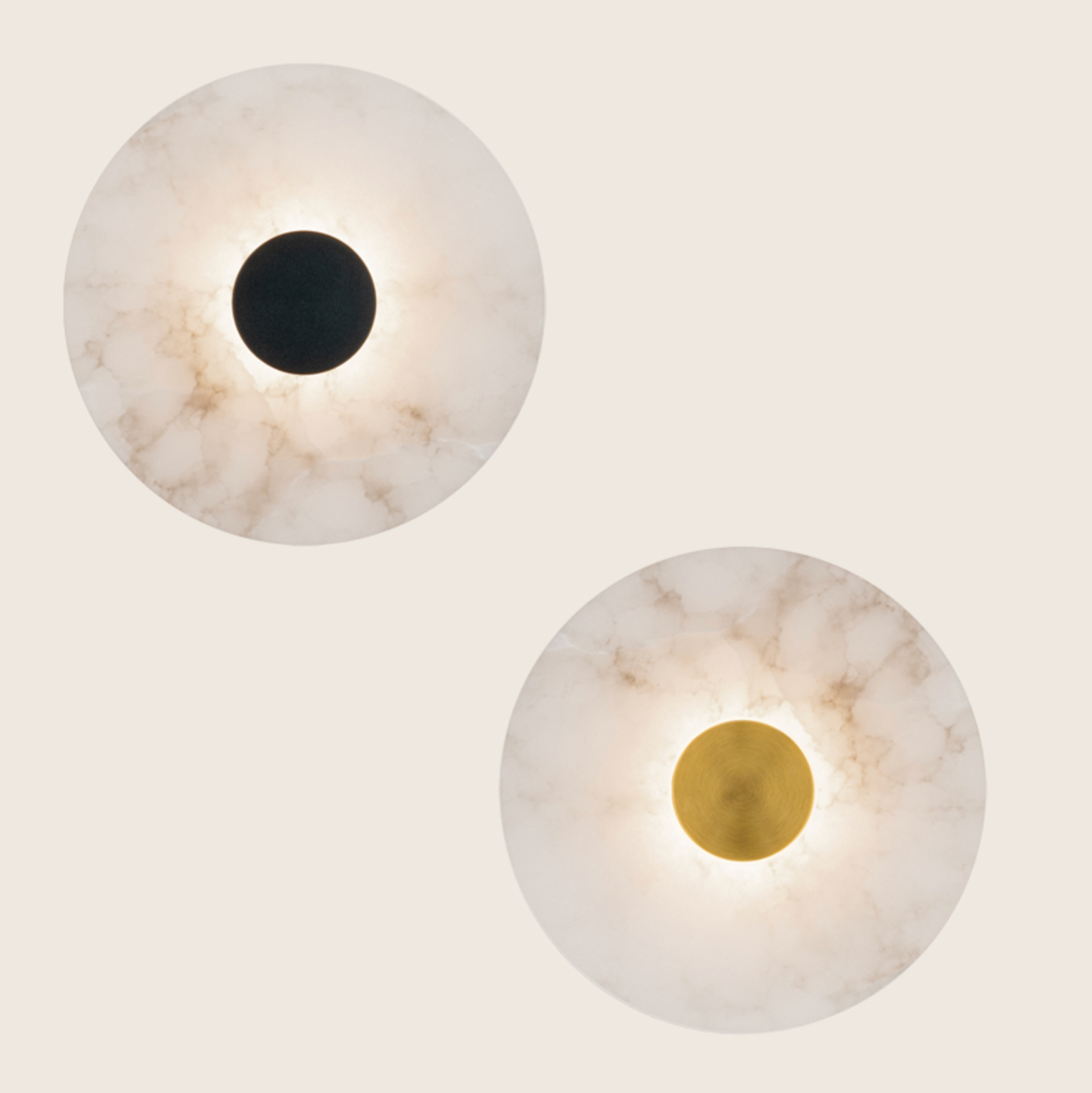 Two spherical wall lights with marble finish and central circular accents on a light grey background