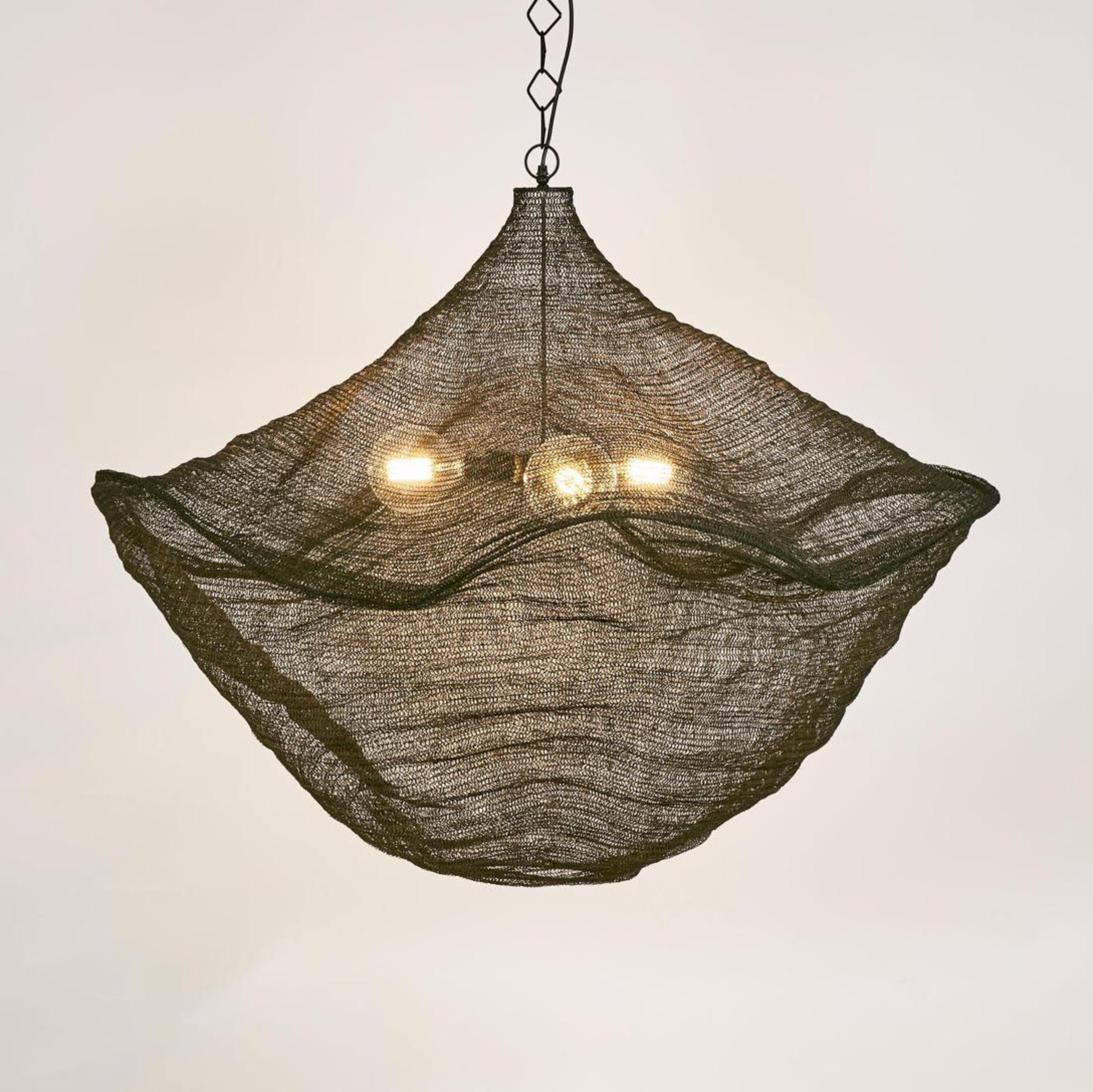 California Pendant Light Black woven brass mesh hanging in styled interior – Emac & Lawton