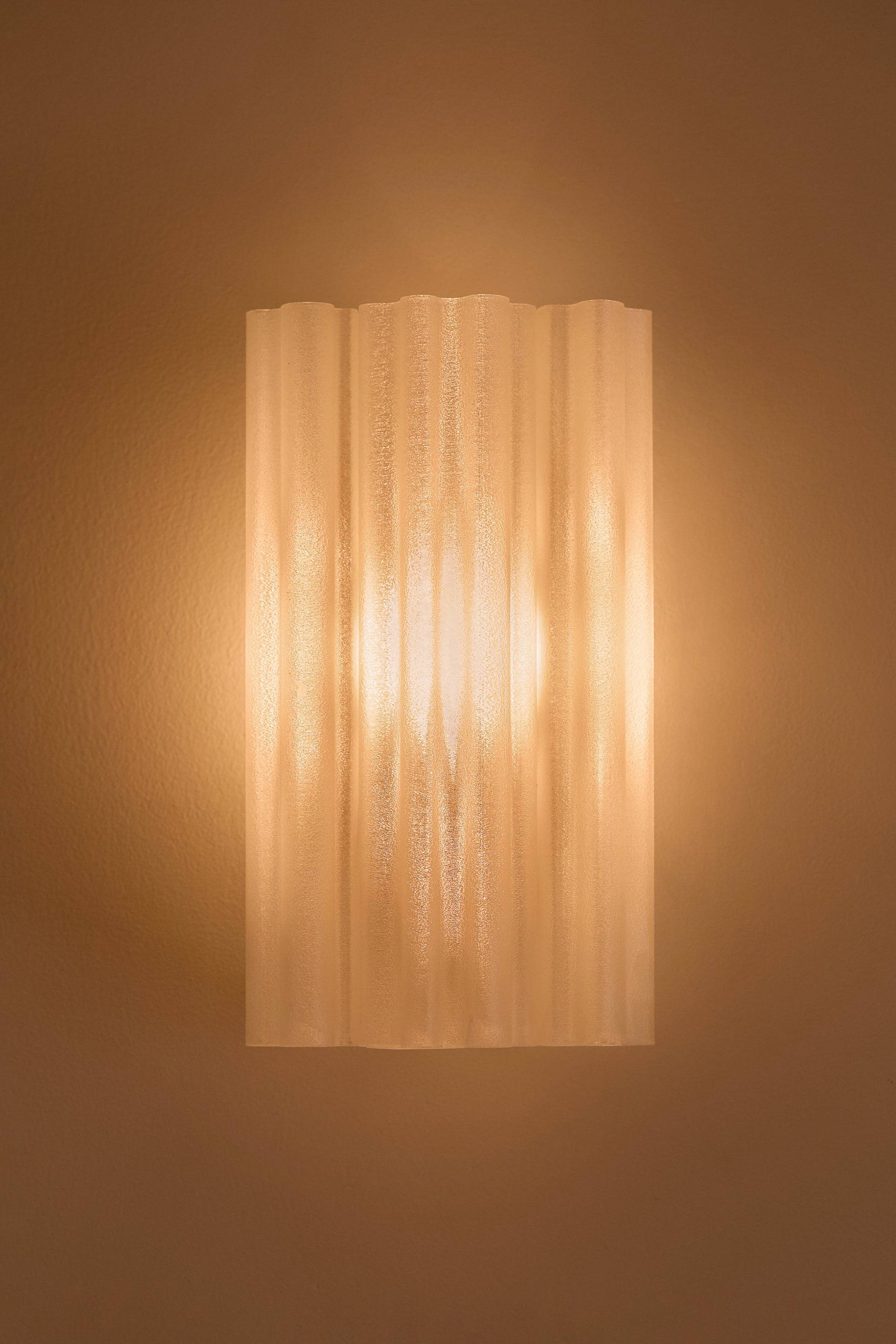 Chloe Wall Light Pearl fluted 3D printed PLA shade illuminated with warm amber glow – Franca Studio