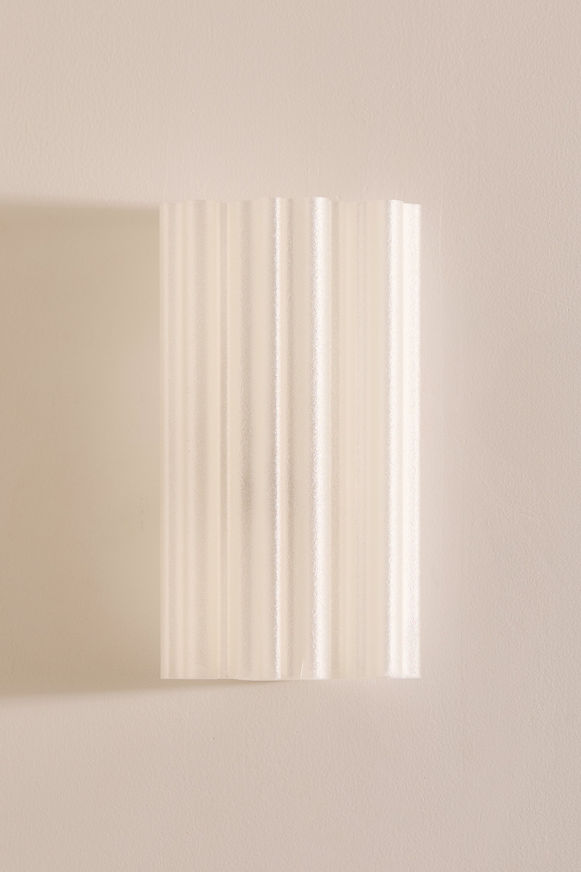Chloe Wall Light Pearl fluted 3D printed PLA shade unlit front view on beige wall – Franca Studio