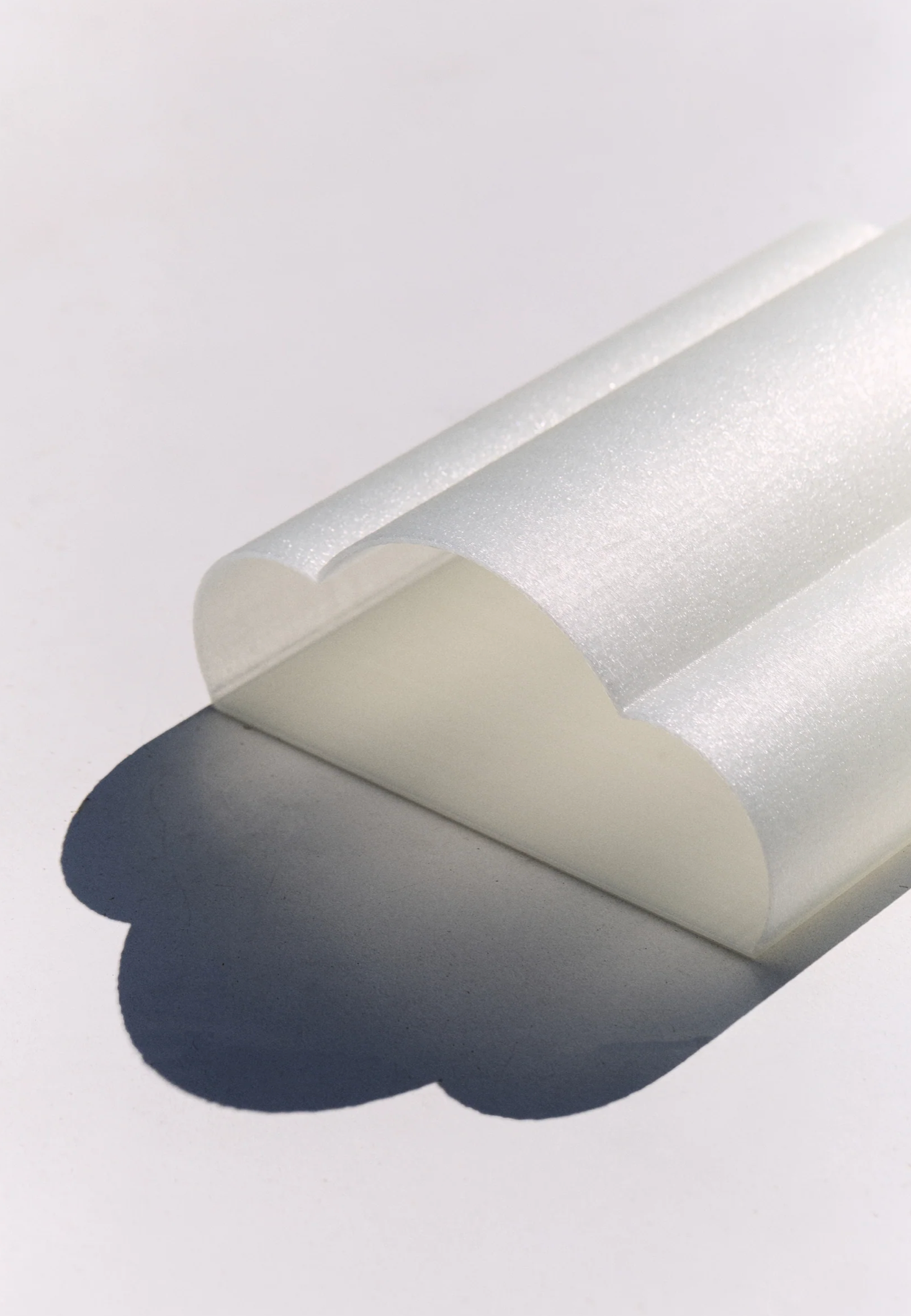 Eloise Wall Light Pearl 3D printed PLA shade overhead view showing sculptural loop shadow on white surface – Franca Studio