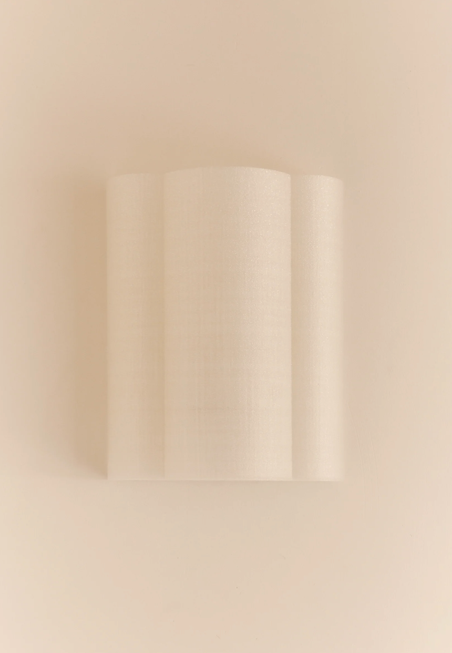 Eloise Wall Light Pearl 3D printed PLA interwoven loop shade unlit front view on beige background – Franca Studio