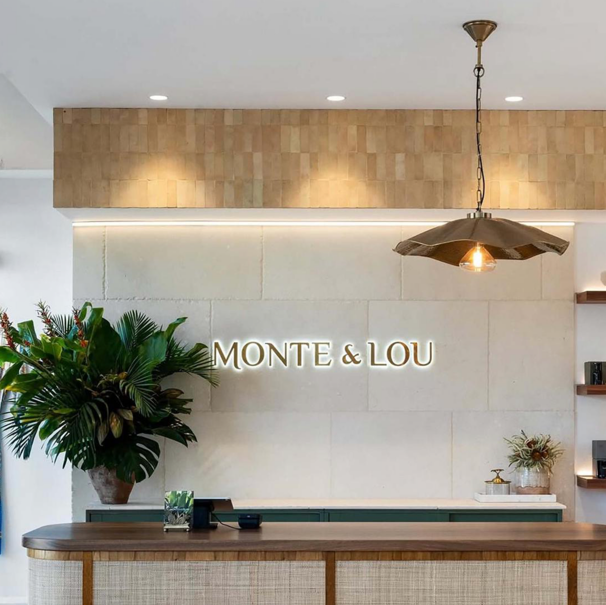 Melville Antique Brass Pendant Light installed in Monte & Lou reception interior – Lightingales