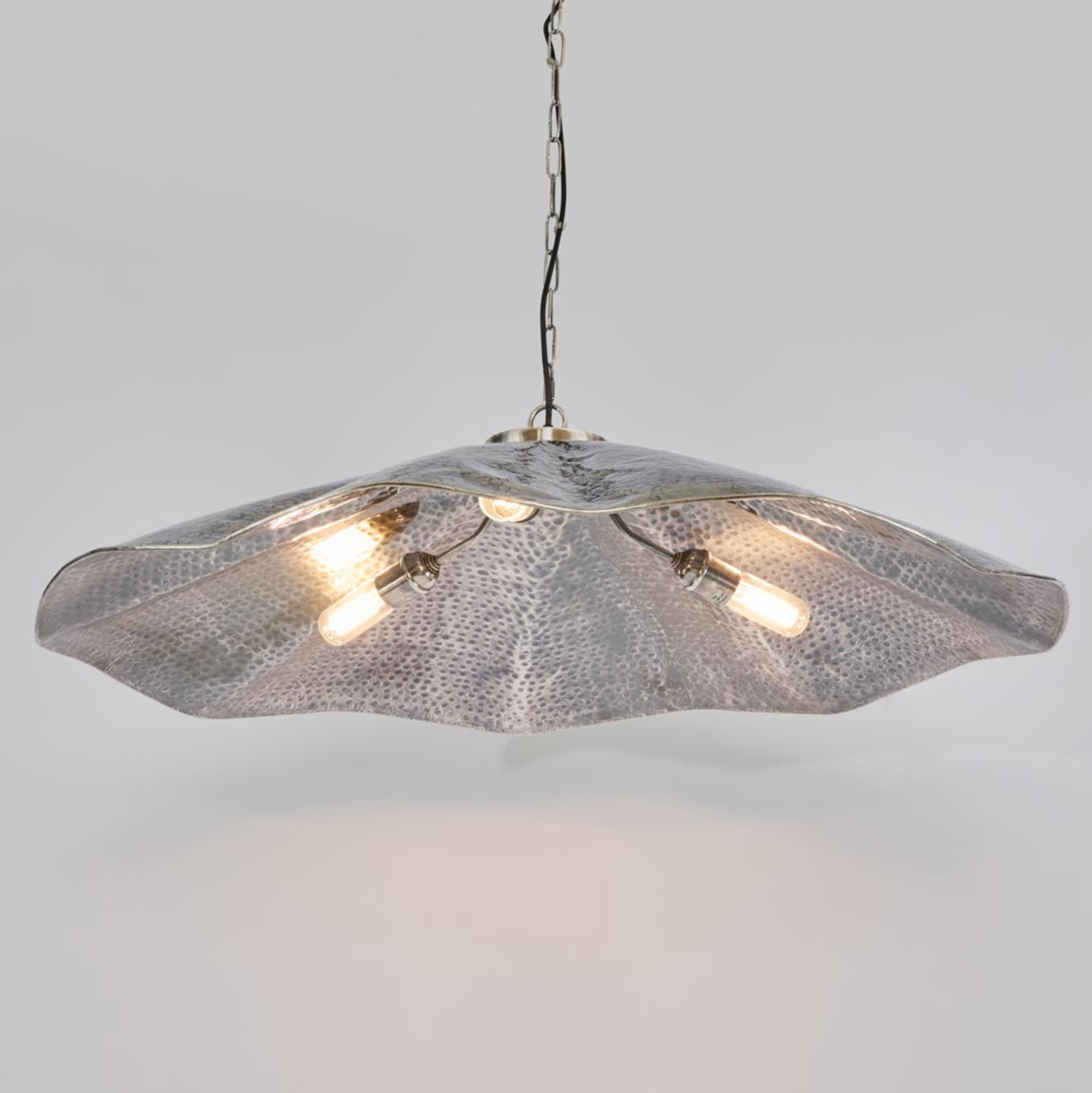 Melville Pendant Light hammered brass illuminated with warm globe bulbs – Lightingales