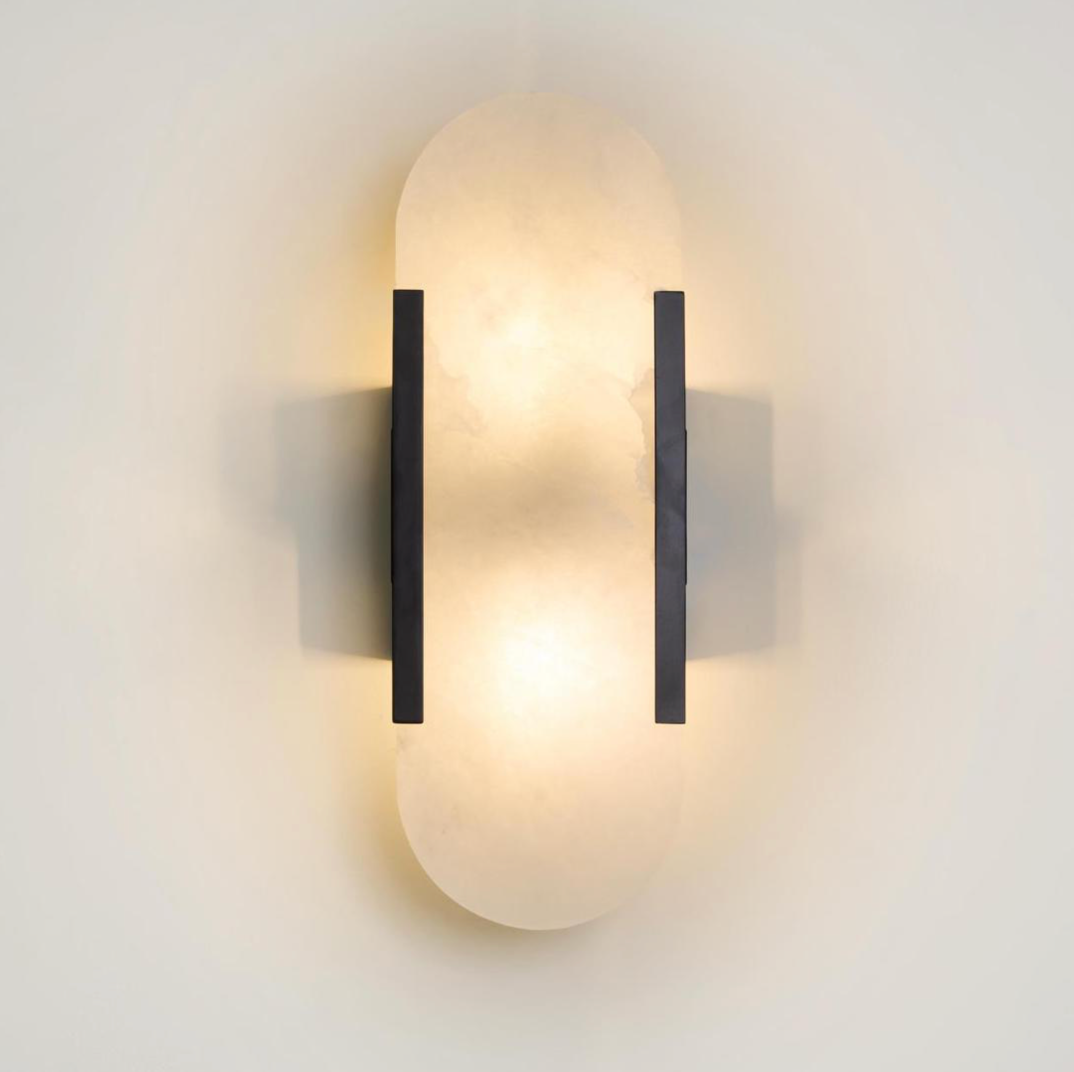 Yves Wall Light black frame alabaster stone shade warm glow illuminated – Lightingales